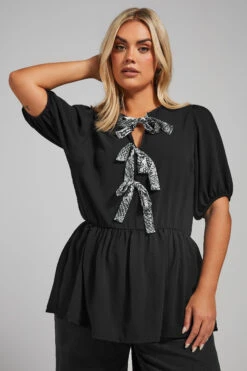 LIMITED COLLECTION - Top Noir Volanté Noeuds Serpent