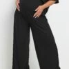 BUMP IT UP MATERNITY - Pantalon Wide Leg Noir Nervuré
